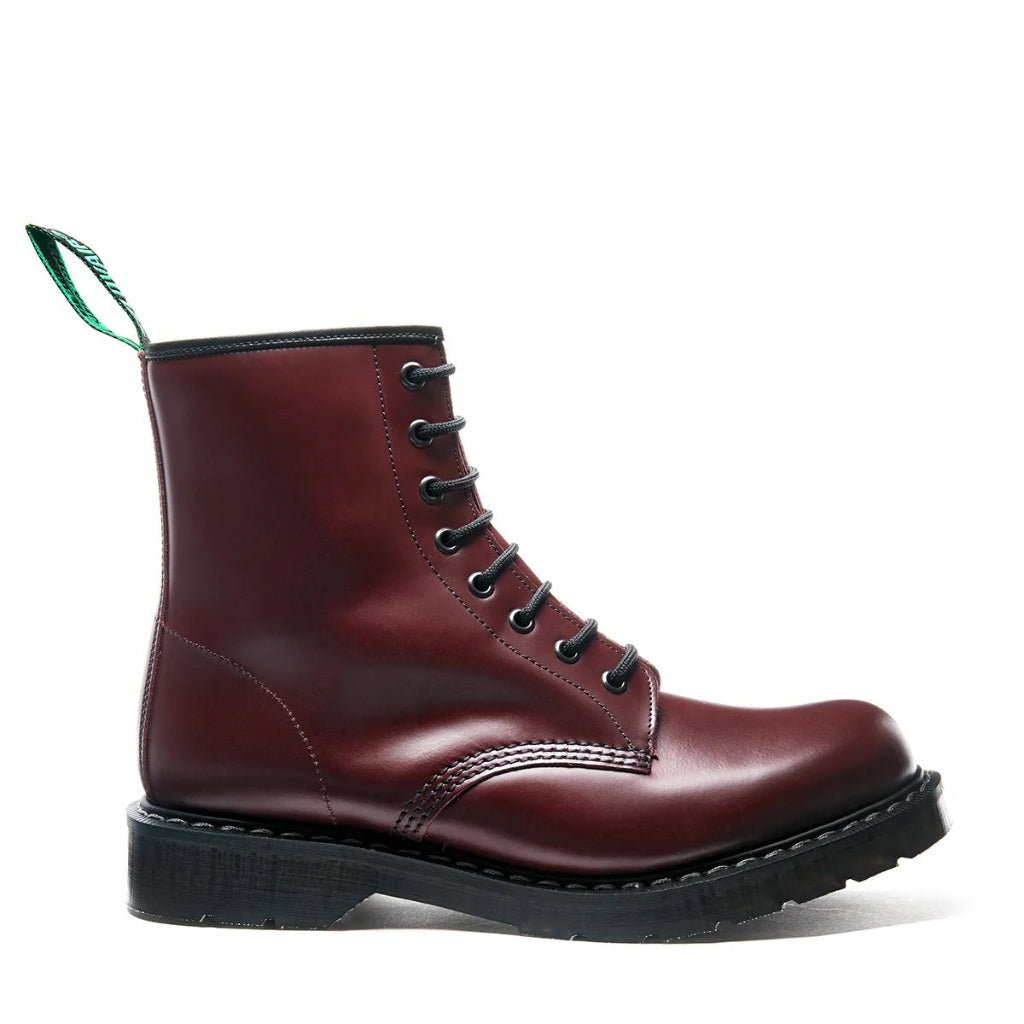Dark Red leather boot with black sole on a white background