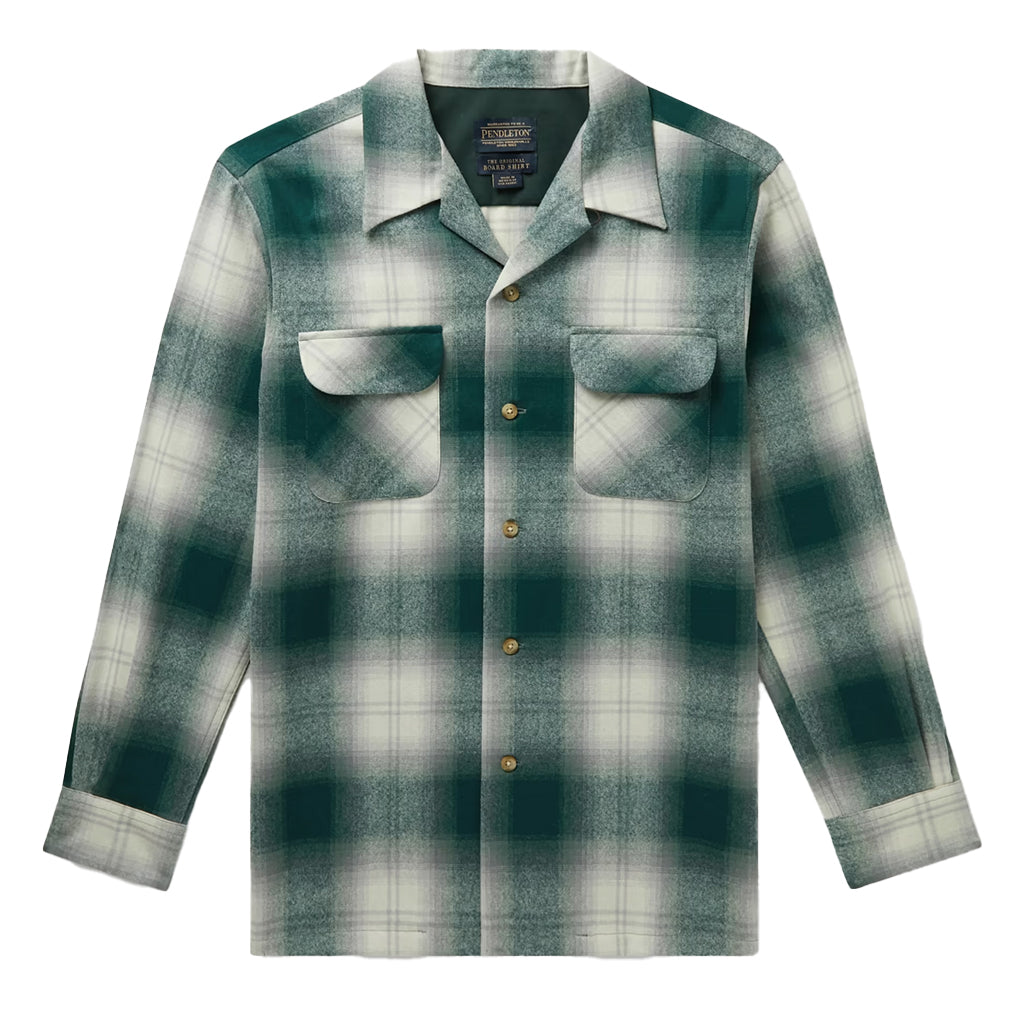 A long-sleeved green and white plaid Pendleton wool shirt with two front pockets and a point collar.