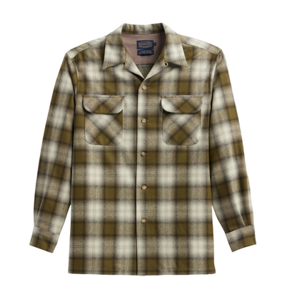 A long-sleeved olive plaid shirt with pockets and a soft collar.