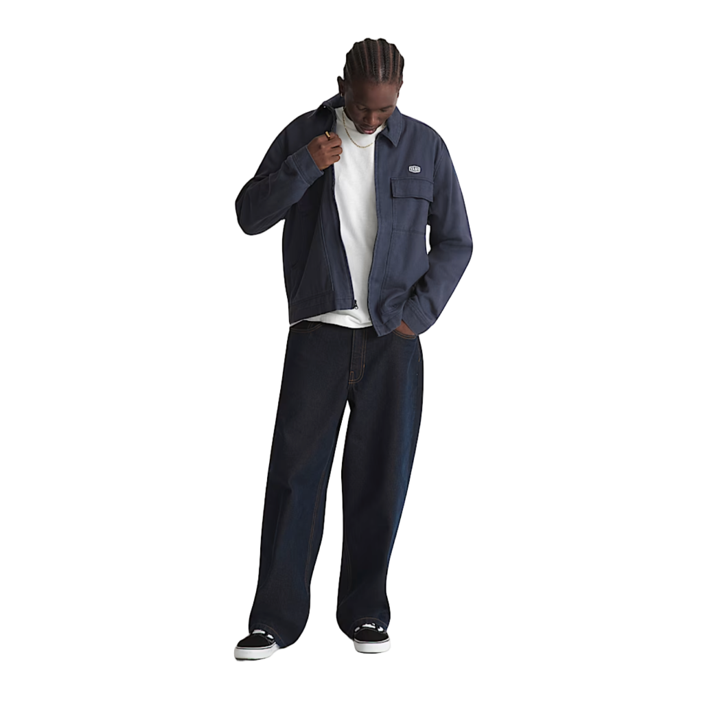 Person wearing a navy jacket and pants on a white background