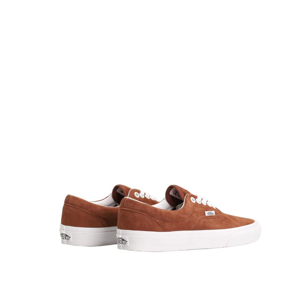 Brown sneakers with white soles on a white background