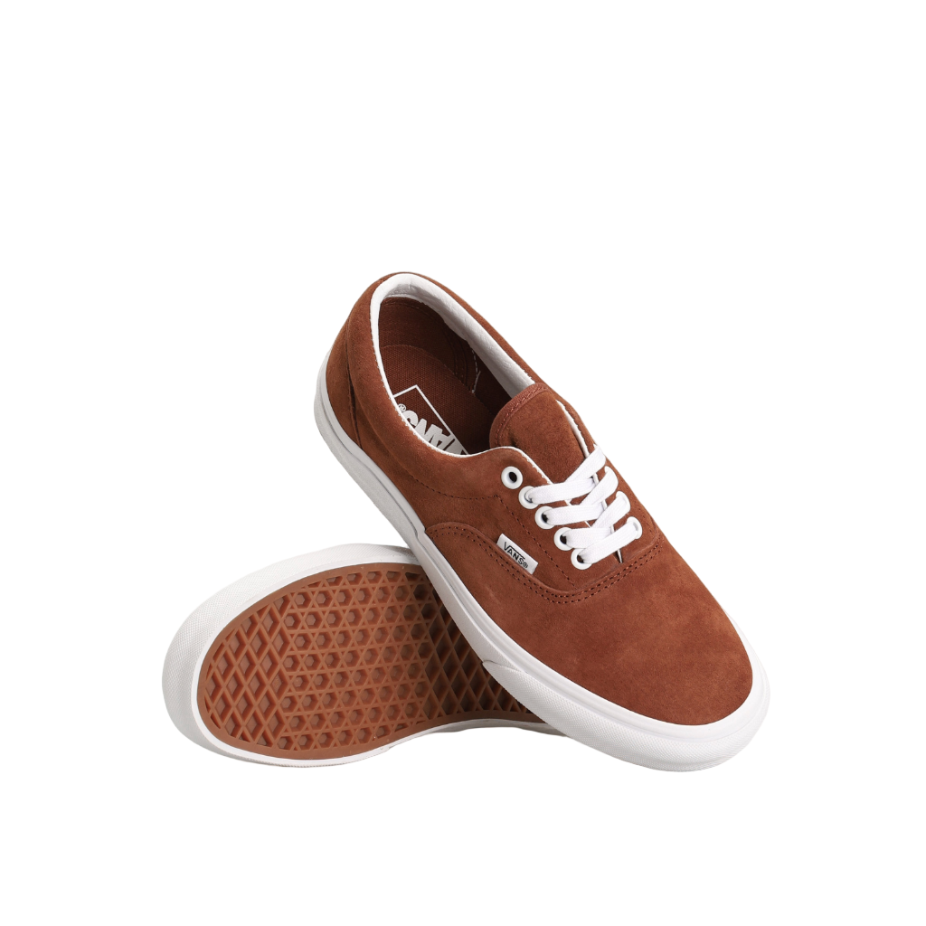 Brown sneakers with white soles on a white background