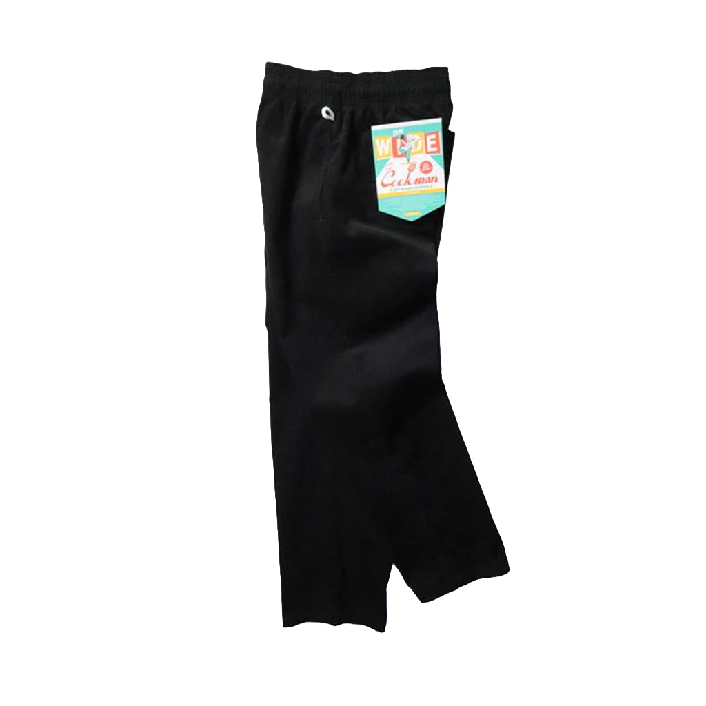Black pants with a colorful label on a white background