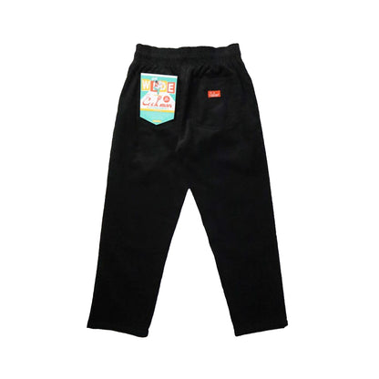 Black pants with colorful labels on a white background