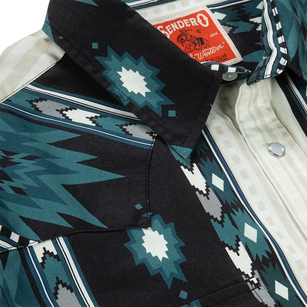 Close-up of a button up with a geometric pattern, featuring a brand tag.