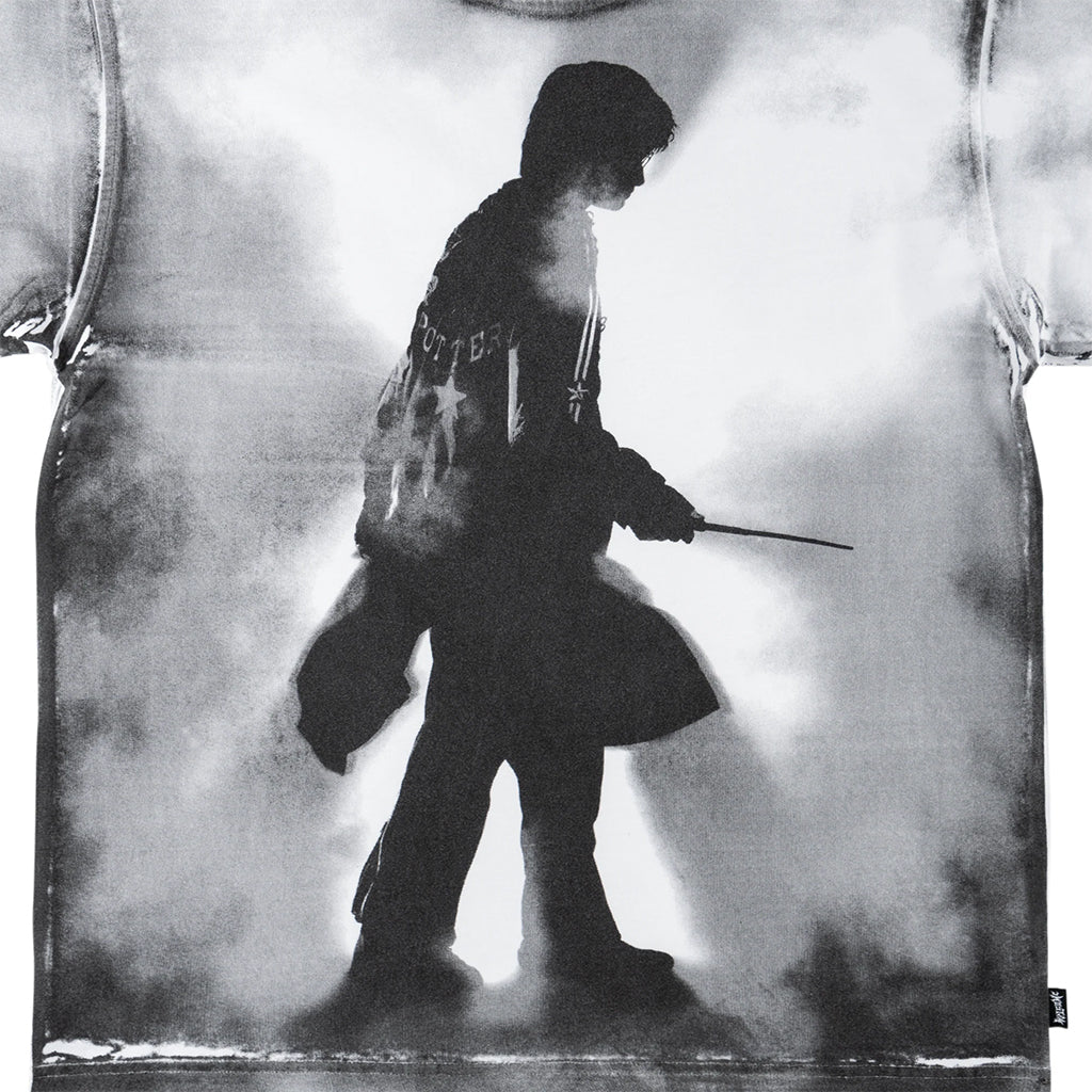 Black and white silhouette of a person holding a weapon against a textured background