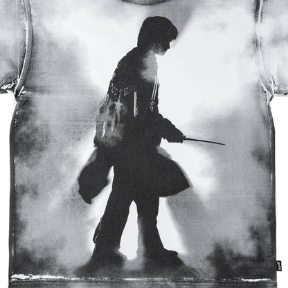 Black and white silhouette of a person holding a weapon against a textured background