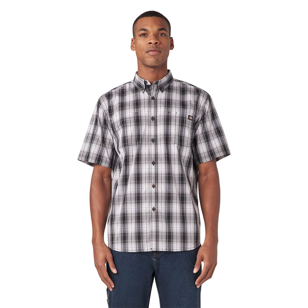 Man wearing a plaid short-sleeve shirt on a white background