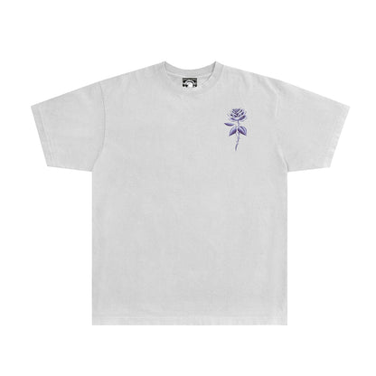 White t-shirt with a purple rose design on a white background