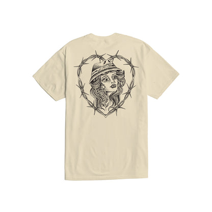 Beige t-shirt with a graphic design of a woman's face surrounded by barbed wire on a white background