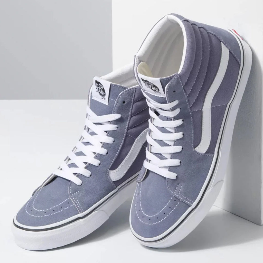 Pair of gray high-top sneakers with white laces on a light gray background