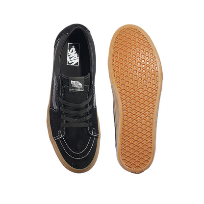 Black sneaker with a brown sole on a white background