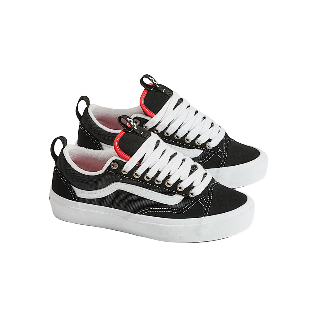 Black and white sneakers with red accents on a white background