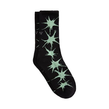 Black sock with green starburst pattern on a white background