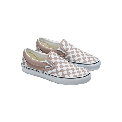 Pair of checkered slip-on shoes on a white background