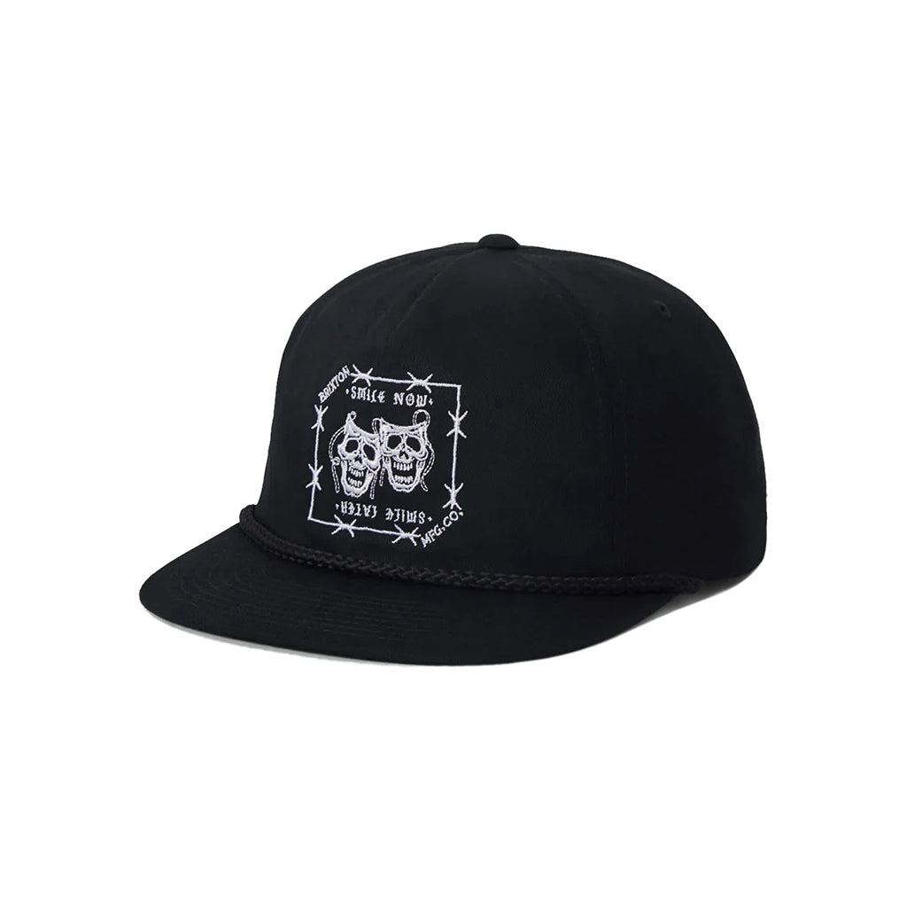 Black cap with white skull design on a white background
