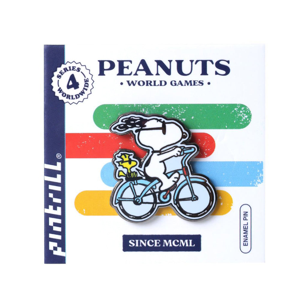 Peanuts-themed enamel pin packaging with Snoopy on a bicycle
