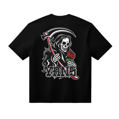 Black t-shirt with a graphic design of a skeleton holding a rose and a scythe, with 'YVNS' branding.