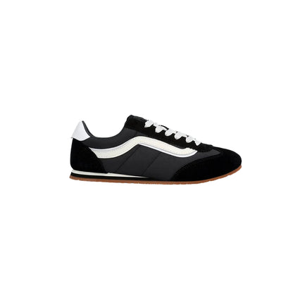 Black and white sneaker with a brown sole on a white background