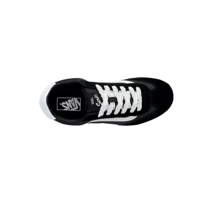 Black and white sneaker with visible brand logo on a white background