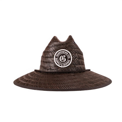 Black straw hat with a Gunthers logo patch on a white background