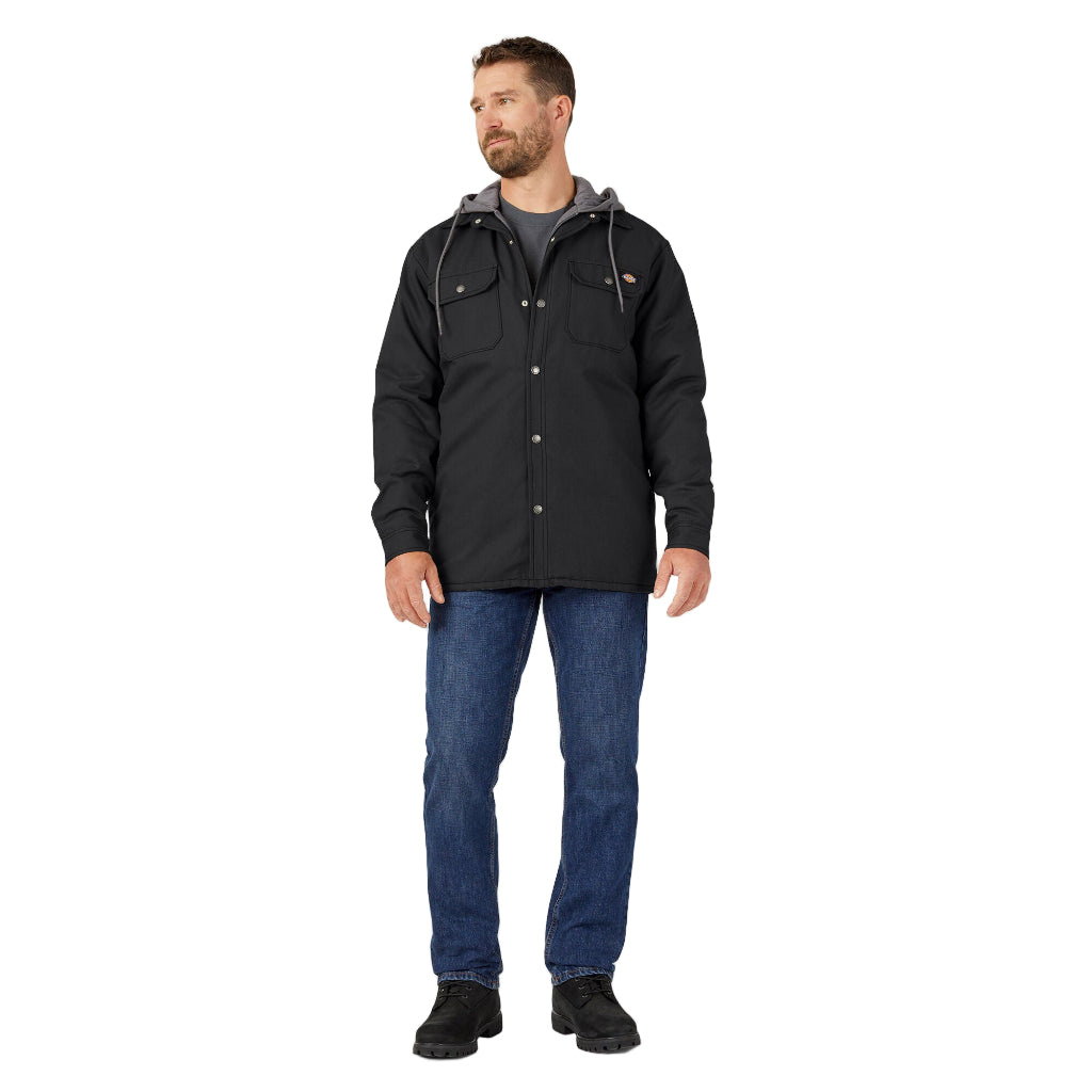 Man wearing a black jacket and blue jeans on a white background