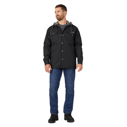Man wearing a black jacket and blue jeans on a white background