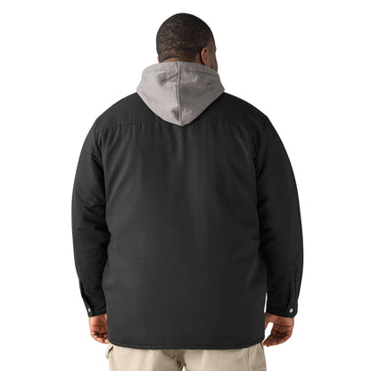 Person wearing a black jacket with a gray hood on a white background
