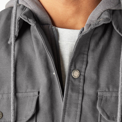 Close-up of a gray jacket with a brand logo on a white background