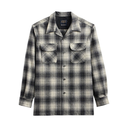 Plaid shirt with a brand logo on a white background