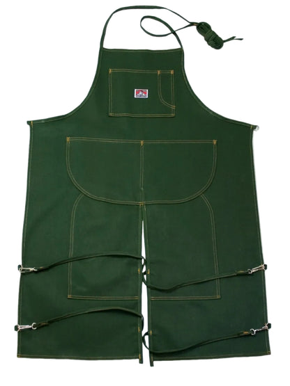 Green apron with multiple pockets on a white background