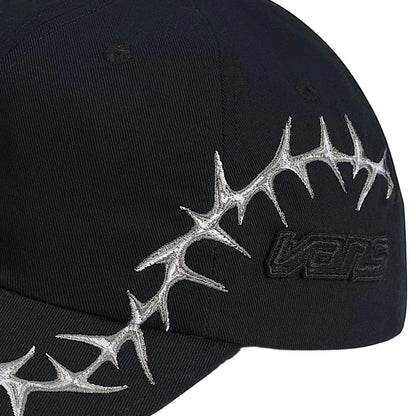 Black cap with silver antler design and Vans logo on a white background