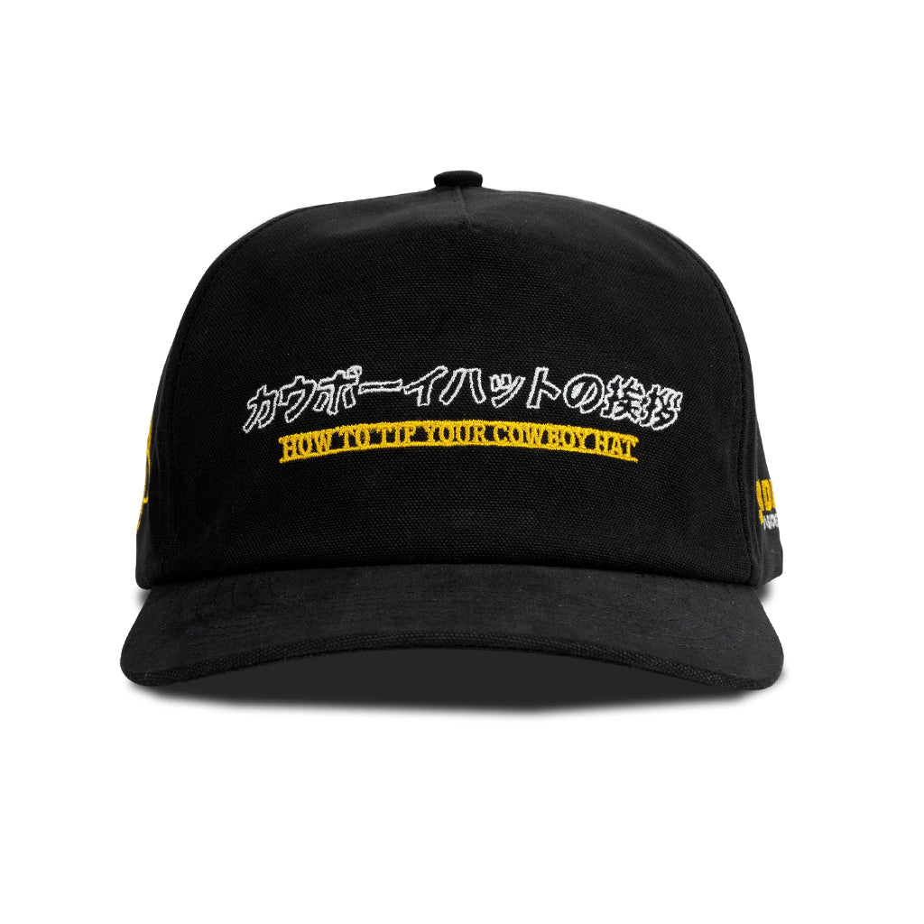 Black cap with yellow text on a white background