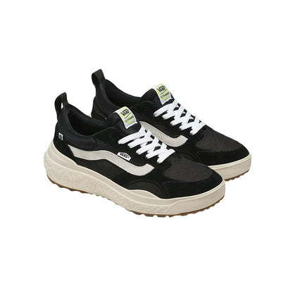 Black and white sneakers with a visible brand logo on a white background