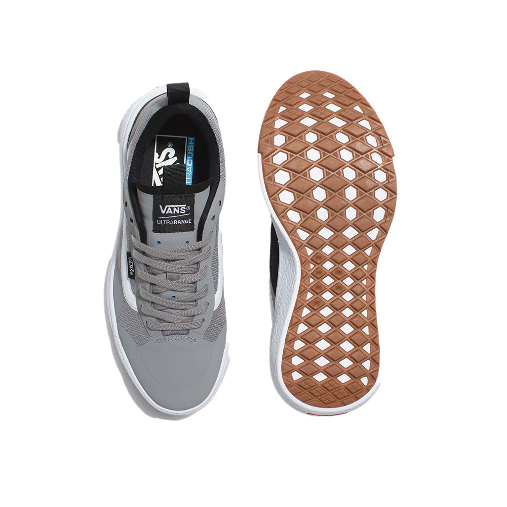 Gray sneaker with brown sole on a white background