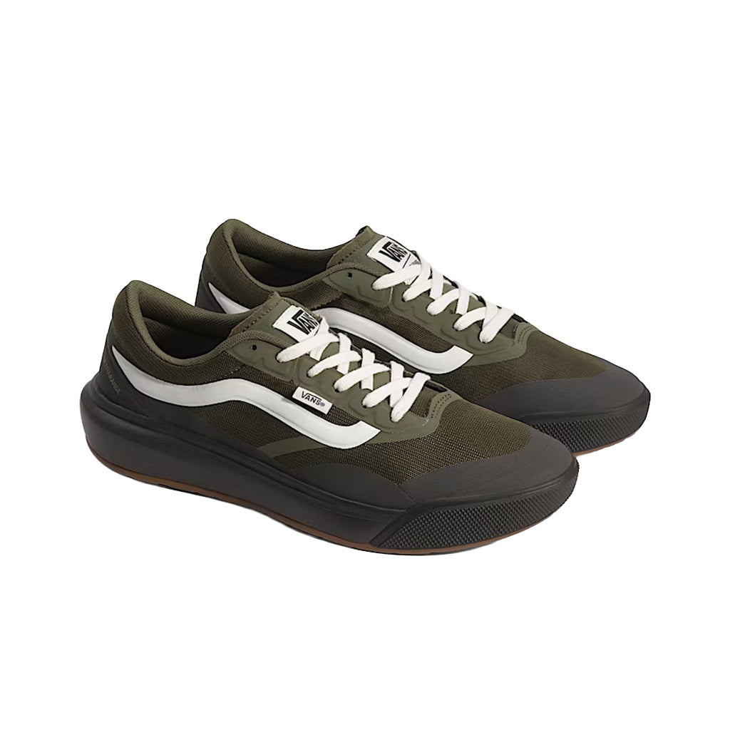 Pair of green sneakers with white laces on a white background
