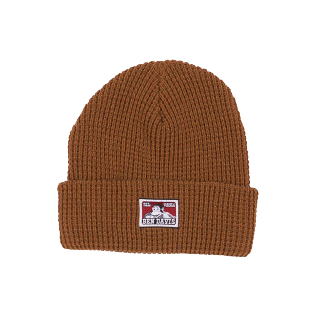 Brown knit beanie with a label on a white background