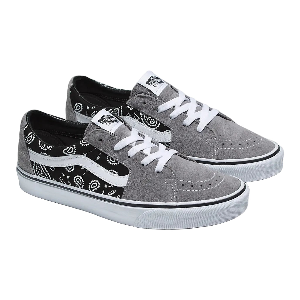 A pair of Vans Sk8 Low Paisley sneakers with grey and white colors and paisley print on the upper part.