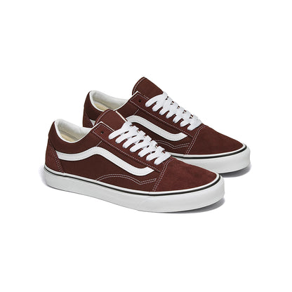 Pair of brown sneakers with white laces and soles on a white background