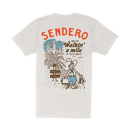 White t-shirt with Sendero graphic design on a white background