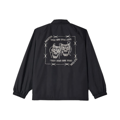 Black jacket with skull design and text on the back against a white background
