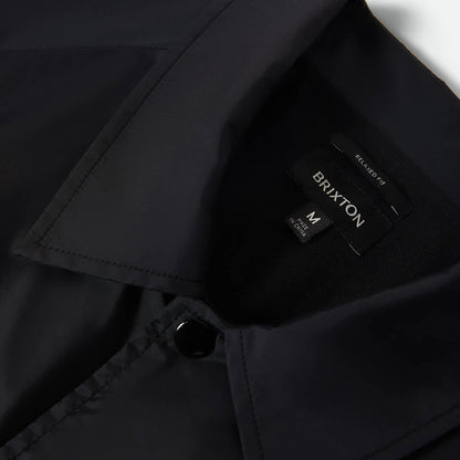 Black jacket with a Brixton label on a white background