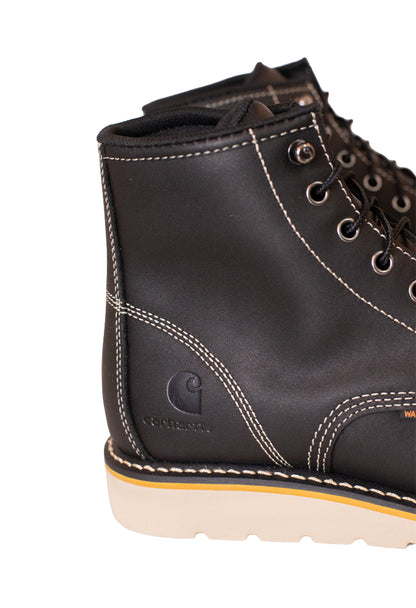 Black leather boot with visible stitching detail on a white background