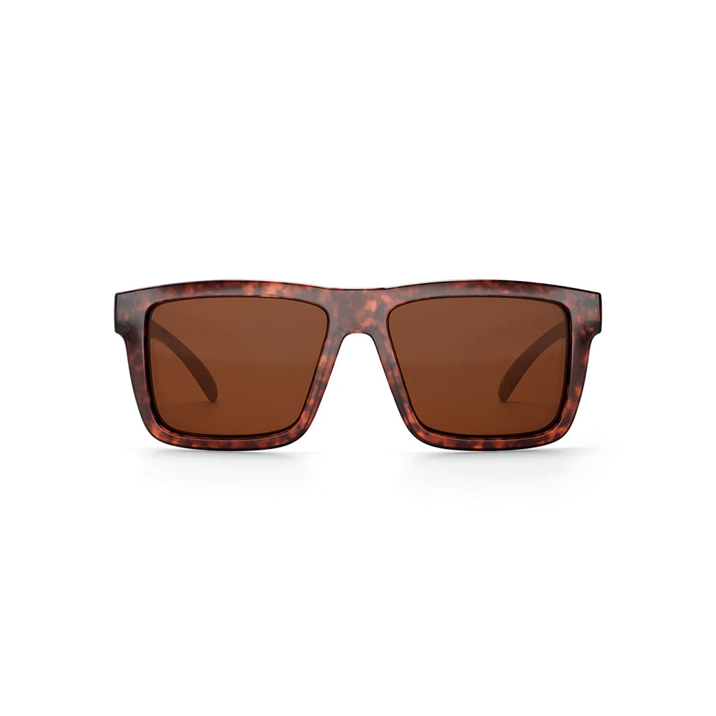 Sunglasses with tortoiseshell frame and brown lenses on a white background