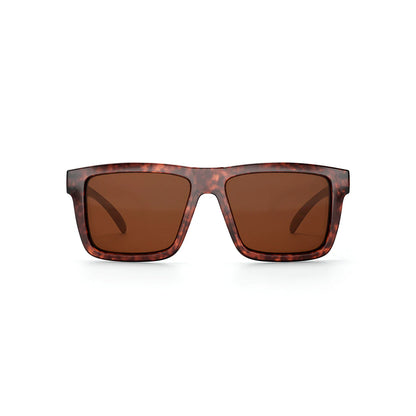 Sunglasses with tortoiseshell frame and brown lenses on a white background