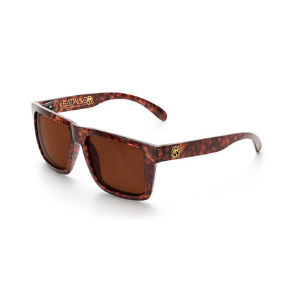 Sunglasses with tortoiseshell frame and brown lenses on a white background