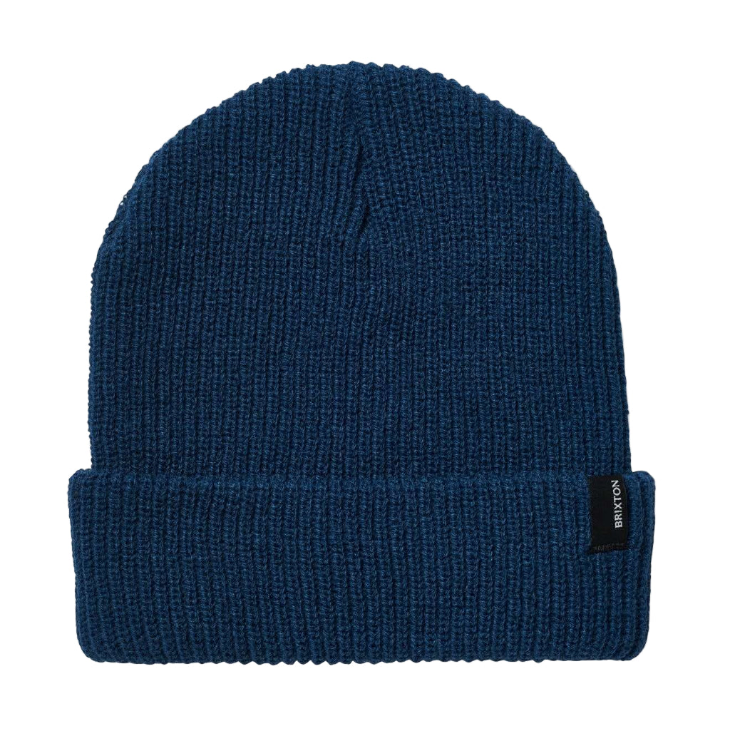 Blue beanie with a brand label on a white background