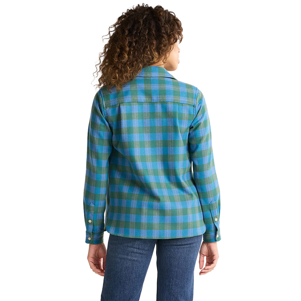 Person wearing a blue and green plaid shirt on a white background