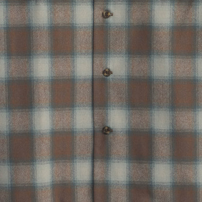 Plaid fabric with brown, blue, and white squares