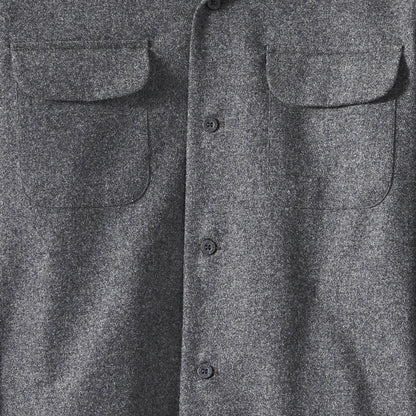 Close-up of a gray flannel shirt with button details